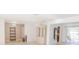Open-concept living room features stylish built-in shelving, pool access, and natural light at 117 Hillcrest Dr, Bradenton, FL 34209