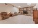 Inviting living room features wood floors, skylights and cozy stone fireplace at 117 Hillcrest Dr, Bradenton, FL 34209