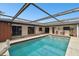 Outdoor pool with a covered pergola, an easy access point, and patio area with chairs at 117 Hillcrest Dr, Bradenton, FL 34209