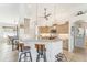 Modern kitchen with light-colored cabinetry, a large island, and stainless steel appliances at 13380 Rayburn Ln, Port Charlotte, FL 33981