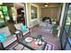 Relaxing screened porch with seating area and view of backyard at 135 Ventosa Pl, Nokomis, FL 34275