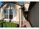 Home's front entrance with walkway at 135 Ventosa Pl, Nokomis, FL 34275