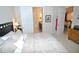 Guest bedroom with queen-size bed and access to a full bathroom at 135 Ventosa Pl, Nokomis, FL 34275