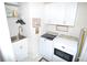 Laundry room with washer, dryer, and ample storage space at 135 Ventosa Pl, Nokomis, FL 34275
