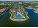 Community resort-style pool with surrounding landscaping at 135 Ventosa Pl, Nokomis, FL 34275