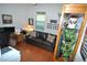 Home office with leather couch, large desk, and built-in shelving at 135 Ventosa Pl, Nokomis, FL 34275