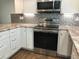 Modern kitchen with stainless steel appliances and granite countertops at 1446 56Th W St # 1446, Bradenton, FL 34209