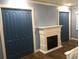 Spacious bedroom with built-in fireplace and double doors at 1446 56Th W St # 1446, Bradenton, FL 34209