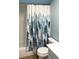 Clean bathroom with a shower/tub combo and a nature-themed shower curtain at 1446 56Th W St # 1446, Bradenton, FL 34209