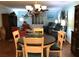 Dining area with a round table and chairs, plus a chandelier at 1446 56Th W St # 1446, Bradenton, FL 34209