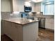 Modern kitchen with granite countertops and stainless steel appliances at 1446 56Th W St # 1446, Bradenton, FL 34209