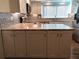Kitchen island with granite countertop and white cabinets at 1446 56Th W St # 1446, Bradenton, FL 34209