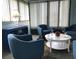 Spacious sunroom with ample seating and natural light at 1446 56Th W St # 1446, Bradenton, FL 34209