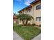 Condo building with attractive landscaping and walkway at 1446 56Th W St # 1446, Bradenton, FL 34209