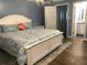 Main bedroom with king-size bed, and hardwood floors at 1446 56Th W St # 1446, Bradenton, FL 34209