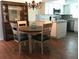 Bright dining area with updated table and chairs near kitchen at 1446 56Th W St # 1446, Bradenton, FL 34209