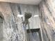 Modern shower with rainfall shower head and marble tile at 1446 56Th W St # 1446, Bradenton, FL 34209