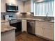Updated kitchen features granite countertops, stainless steel appliances, and stylish cabinetry at 1446 56Th W St # 1446, Bradenton, FL 34209