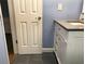 Updated bathroom with gray tile floors and a modern vanity at 1446 56Th W St # 1446, Bradenton, FL 34209