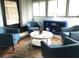 Bright sunroom with comfy chairs, a coffee table, and a coastal vibe at 1446 56Th W St # 1446, Bradenton, FL 34209