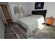 Comfortable bedroom with a queen-size bed, wood nightstand, and ample closet space at 1508 Pelican Cove Rd # Gr233, Sarasota, FL 34231