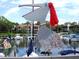 Boats docked at the marina with a unique pelican decoration at 1508 Pelican Cove Rd # Gr233, Sarasota, FL 34231