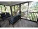 Relaxing lanai with patio furniture and view of lush landscaping at 1508 Pelican Cove Rd # Gr233, Sarasota, FL 34231