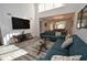 Bright living room featuring a large TV, comfortable sofa, and stylish coffee table at 1508 Pelican Cove Rd # Gr233, Sarasota, FL 34231