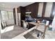Modern kitchen with dark cabinetry, stainless steel appliances, and granite countertops at 1508 Pelican Cove Rd # Gr233, Sarasota, FL 34231