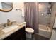 Updated bathroom with granite vanity, tiled shower/tub combo, and neutral decor at 1508 Pelican Cove Rd # Gr233, Sarasota, FL 34231