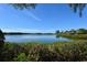 Stunning view of calm water, lush mangroves, and distant homes at 1508 Pelican Cove Rd # Gr233, Sarasota, FL 34231