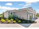 Elegant home exterior featuring a neutral color scheme, well-kept landscaping, and a paver driveway at 16112 Isola Pl, Bradenton, FL 34211