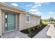Home with a charming turquoise front door and meticulously landscaped walkway at 16112 Isola Pl, Bradenton, FL 34211