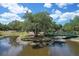 Scenic pond with a footbridge and lush trees at 2110 Hawthorne St, Sarasota, FL 34239