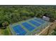 Aerial view of three well-maintained tennis courts at 2110 Hawthorne St, Sarasota, FL 34239