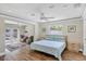 Spacious primary bedroom with wood floors and access to the backyard patio at 2110 Hawthorne St, Sarasota, FL 34239