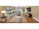 Spacious living room with tiled floors, neutral colors, and access to the patio at 2110 Hawthorne St, Sarasota, FL 34239
