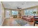 Bright living room featuring tile floors, plantation shutters, and ample natural light at 2110 Hawthorne St, Sarasota, FL 34239