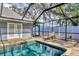 Enjoy this relaxing screened-in pool area at 2110 Hawthorne St, Sarasota, FL 34239