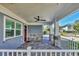 Covered front porch with stone columns and white railing at 2110 Hawthorne St, Sarasota, FL 34239