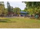 Community playground with fitness equipment and shaded areas at 2110 Hawthorne St, Sarasota, FL 34239