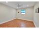 Simple bedroom with tile floors and ceiling fan at 2110 Hawthorne St, Sarasota, FL 34239