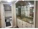 Wet bar with granite countertop and mirrored backsplash at 232 Nina Way, Oldsmar, FL 34677