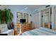 Bedroom with dresser, bed, and large mirror at 2901 26Th W St # 818, Bradenton, FL 34205