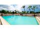 Inviting community pool with lounge chairs and patio tables at 2901 26Th W St # 818, Bradenton, FL 34205