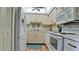 Well-equipped kitchen with white appliances and wood floors at 2901 26Th W St # 818, Bradenton, FL 34205