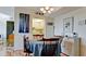 Charming dining area with wood floors and kitchen view at 2901 26Th W St # 818, Bradenton, FL 34205