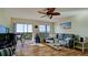 Bright living room with hardwood floors and a balcony view at 2901 26Th W St # 818, Bradenton, FL 34205