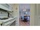 Kitchen features white appliances and view to dining area at 2901 26Th W St # 818, Bradenton, FL 34205