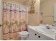Small bathroom with shower/tub combo and beach-themed decor at 3115 Live Oak Ln # 30, Palmetto, FL 34221